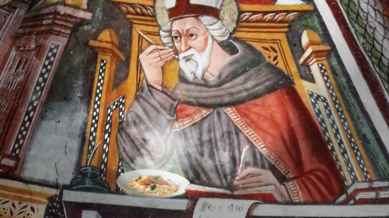 Sant'Ambrogio mangia un piatto di risotto al pesce persico