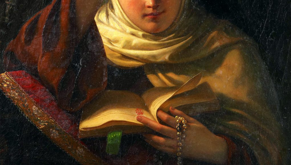 Figura di una monaca mentre legge un libro